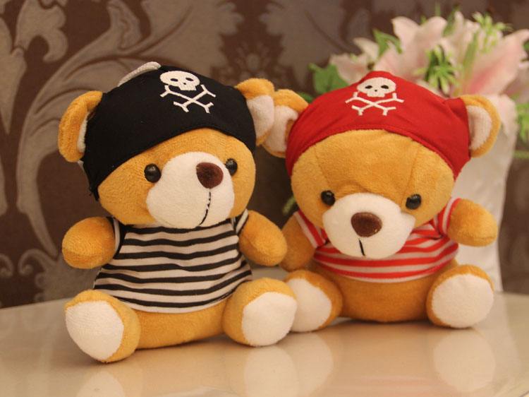 A couple of teddy bear with hat